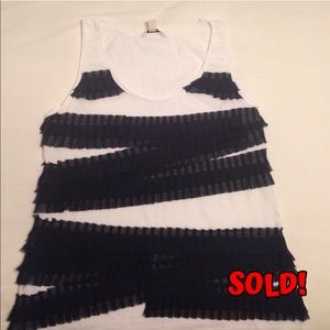 White top with navy pleated ruffles.